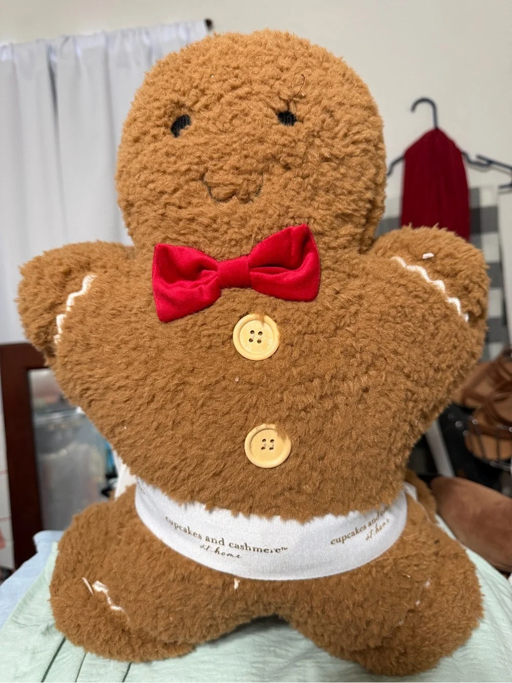 cupcakes & cashmere Brown Gingerbread Family Plush Holiday Pillow with Red Bow